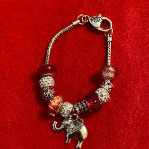 Red and white charm bracelet.